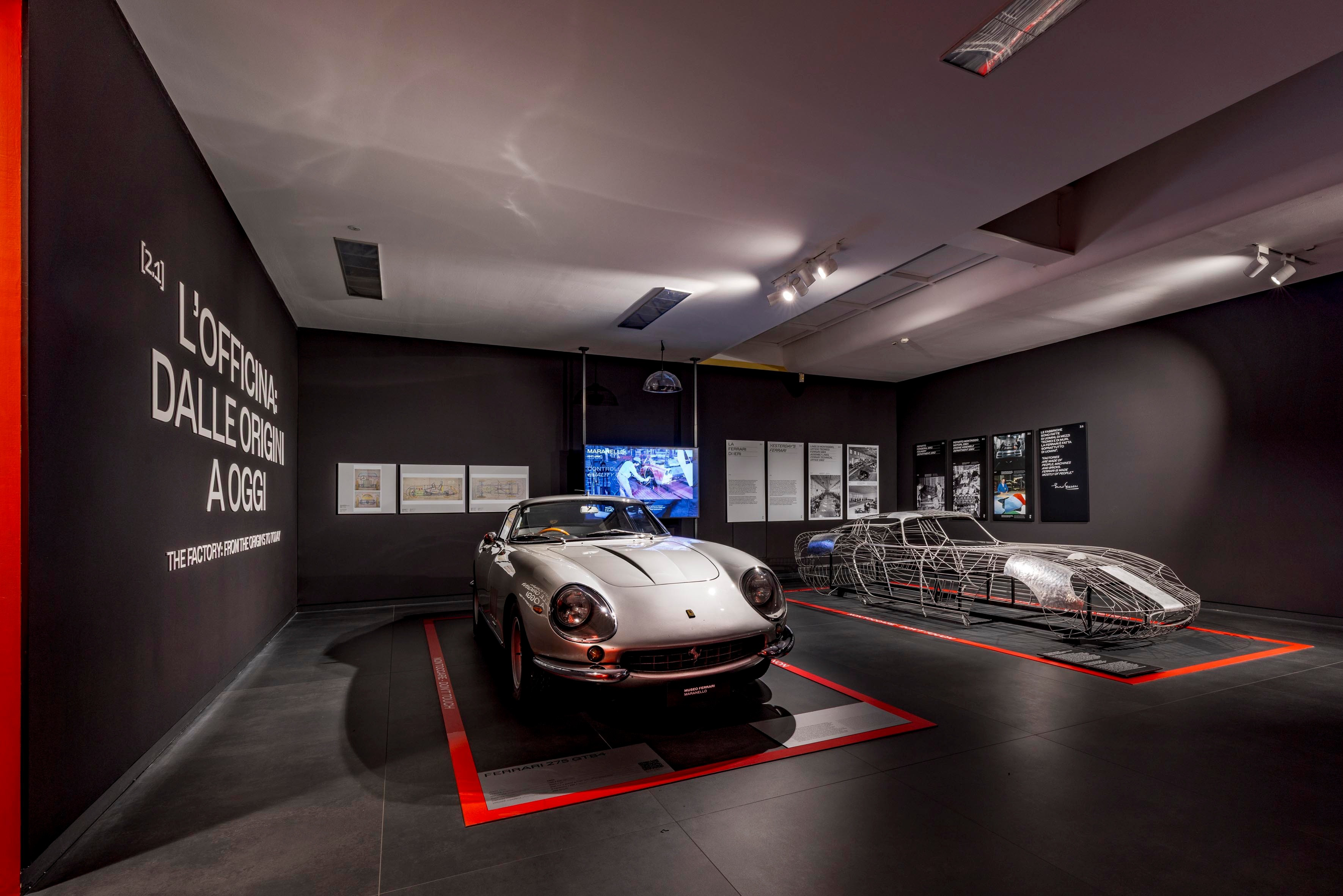 a car in a room with several metal sleds