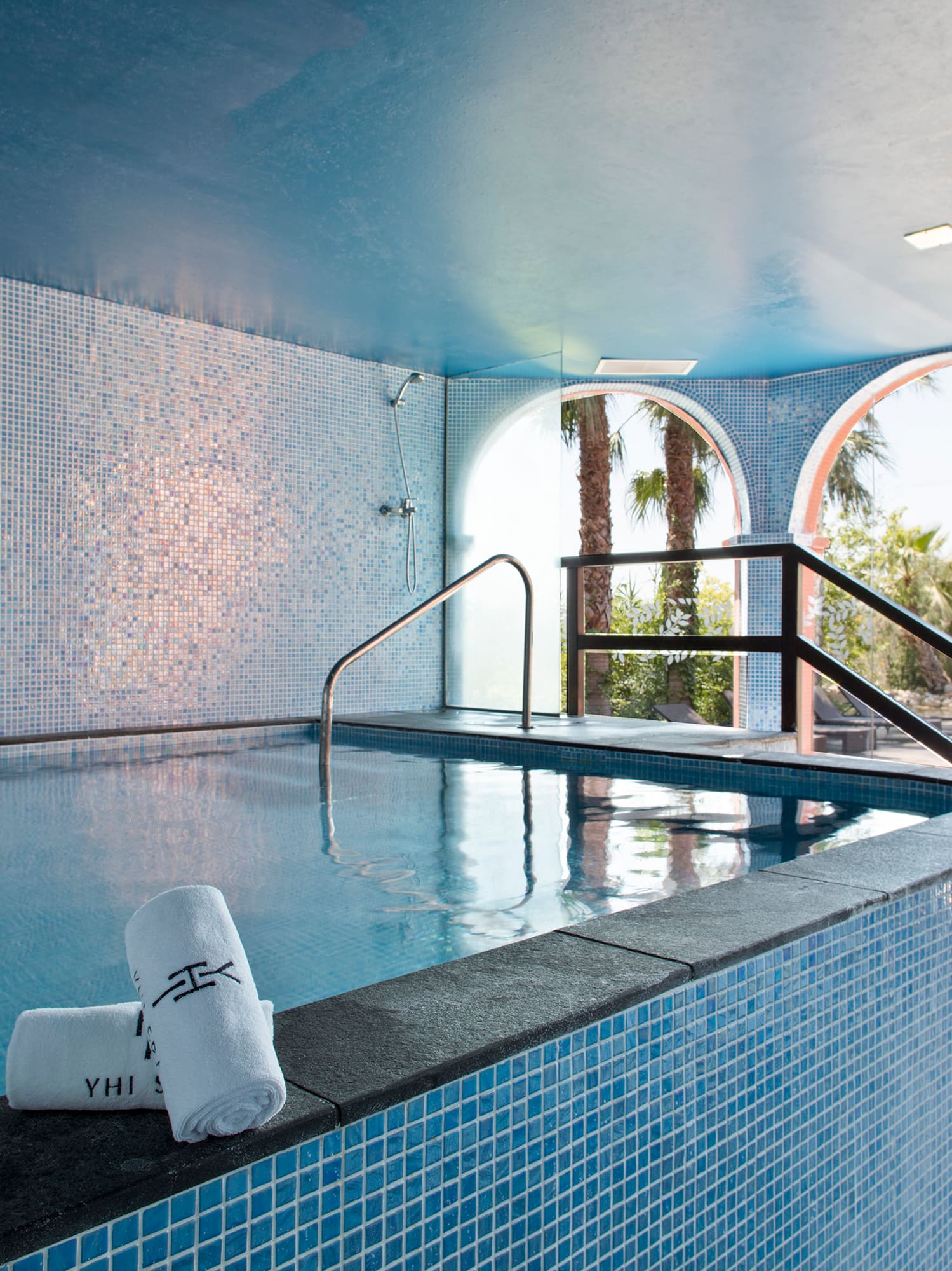 a pool with towels on the side