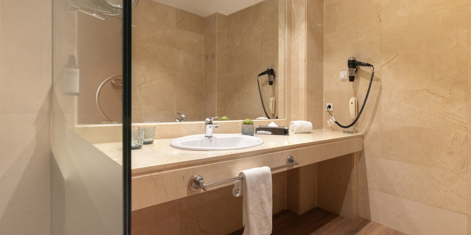 a bathroom with a mirror and sink