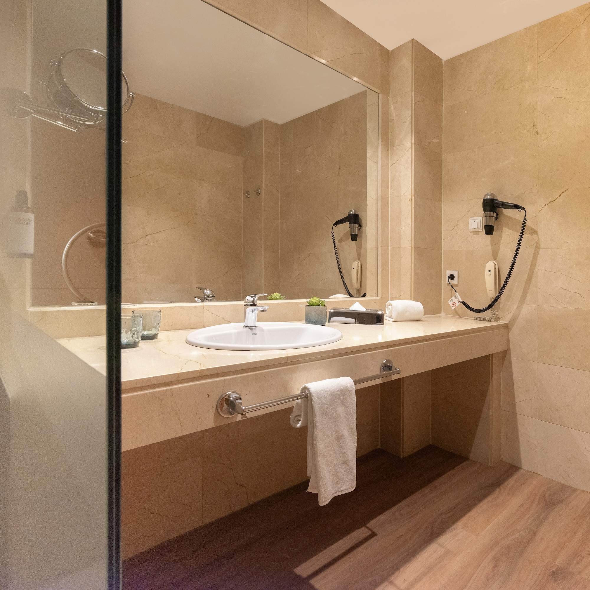 a bathroom with a mirror and sink