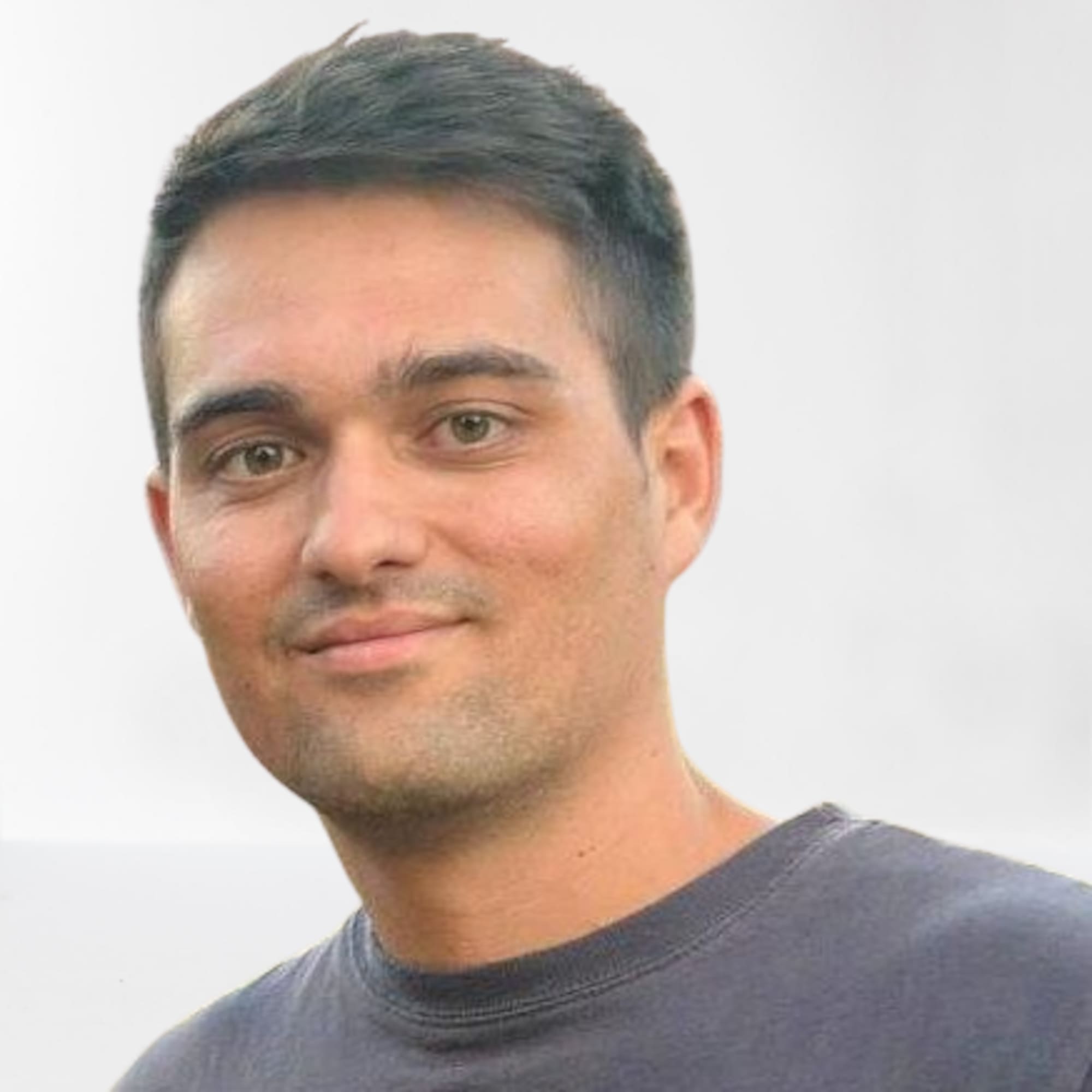 a man smiling for a picture