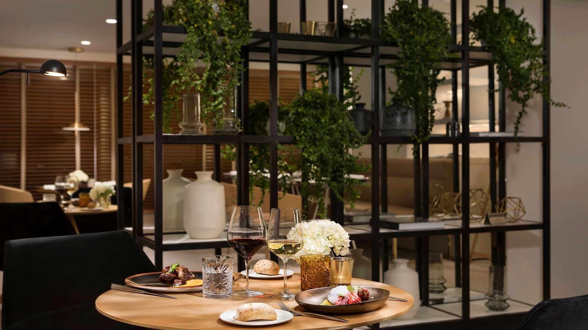 a table with food and wine glasses on it