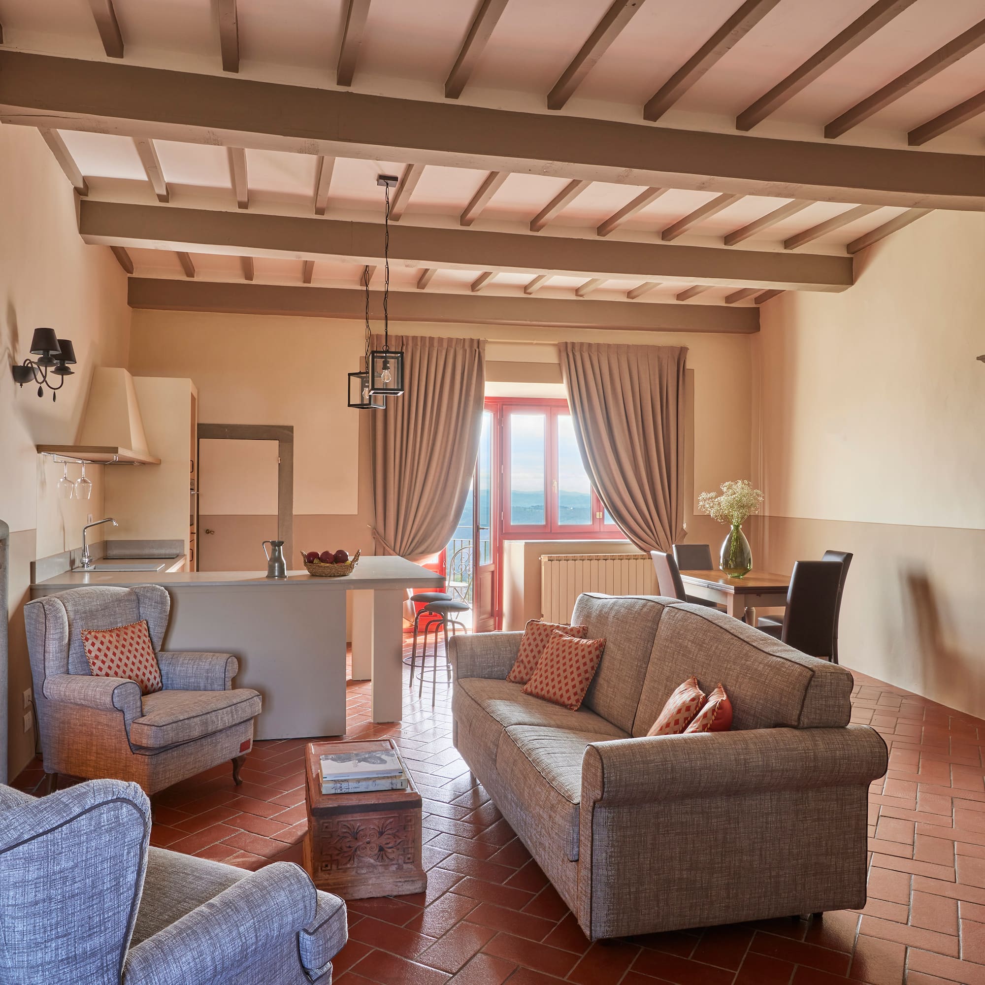 a living room with couches and chairs